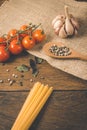 Italian food cooking ingredients. Pasta, vegetables, spices Royalty Free Stock Photo