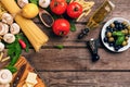 Italian food cooking-tomatoes, basil, pasta, olive oil and cheese on wooden background, top view, copy space.