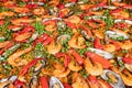 Italian food , delicious meal with shrimp , Mussel and spices pepper seafood in huge frying pan for sale at weekend street food