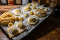 Italian food, fresh home made stuffed pasta tortelli or ravioli dumplings ready to cook, Parma, Emilia Romagna, Italy