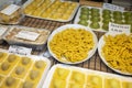 Italian food, fresh home made stuffed pasta tortelli or ravioli dumplings ready to cook, Parma, Emilia Romagna, Italy. Italian Royalty Free Stock Photo