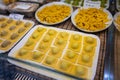 Italian food, fresh home made stuffed pasta tortelli or ravioli dumplings ready to cook, Parma, Emilia Romagna, Italy. Italian Royalty Free Stock Photo