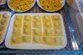 Italian food, fresh home made stuffed pasta tortelli or ravioli dumplings ready to cook, Parma, Emilia Romagna, Italy. Italian Royalty Free Stock Photo