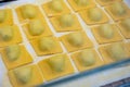 Italian food, fresh home made stuffed pasta tortelli or ravioli dumplings ready to cook, Parma, Emilia Romagna, Italy. Italian Royalty Free Stock Photo