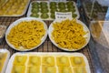 Italian food, fresh home made stuffed pasta tortelli or ravioli dumplings ready to cook, Parma, Emilia Romagna, Italy. Italian Royalty Free Stock Photo