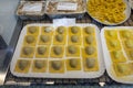 Italian food, fresh home made stuffed pasta tortelli or ravioli dumplings ready to cook, Parma, Emilia Romagna, Italy. Italian Royalty Free Stock Photo