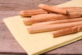 Italian food, Grissini bread sticks on wooden table.