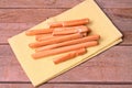 Italian food, Grissini bread sticks on wooden table.