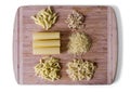 Italian food - heap of macaroni, spaghetti, noodles, pasta and cannelloni tubes - selective soft focus - clipping path