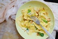 Italian food. Home made fresh Ravioli pasta with spinach and ricotta cheese, fresh basil and, black pepper, parmesan cheese Royalty Free Stock Photo