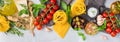 Italian food ingredients with pasta, tomatoes, cheese, olive oil, basil Royalty Free Stock Photo