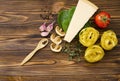 Italian food ingredients: pasta, tomato, spinach, pepper, porcini on wooden background Royalty Free Stock Photo