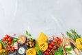 Italian food ingredients with pasta, tomatoes, cheese, olive oil, basil Royalty Free Stock Photo