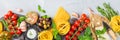 Italian food ingredients with pasta, tomatoes, cheese, olive oil, basil Royalty Free Stock Photo