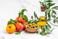 Italian food ingredients. Vegetables, olive oil, herbs and spices on light background. place for text, top view Royalty Free Stock Photo