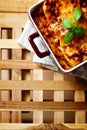 Italian Food. Lasagna plate on wooden table. Royalty Free Stock Photo