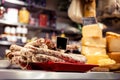 Italian food market with cheese and pepperoni, salsicella dolce, Tuscan delicatessen stall display, Florence, Italy Royalty Free Stock Photo