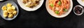 Italian food panorama for a restaurant menu with a place for text. Ravioli, mushroom pasta, tomato pasta and olives
