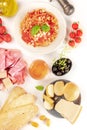 Italian food. Pasta, cheese, ham, wine, tomatoes, shot from above Royalty Free Stock Photo