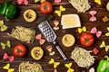 Italian Food Pasta Ingredients on Wooden Table Top View Pasta Background Variety of Pasta and Vegetables Flat Lay Cheese Red Green Royalty Free Stock Photo