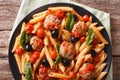 Italian Food: Pasta with meatballs, olives and tomato sauce closeup. Horizontal top view Royalty Free Stock Photo