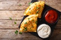 Italian food: pizza calzone with meat, vegetables and cheese close-up. horizontal top view Royalty Free Stock Photo