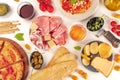 Italian food. Pizza, pasta, cheese, ham, wine, olives, pesto, tomatoes, shot from the top Royalty Free Stock Photo