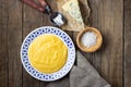 Italian food polenta with cheese gorgonzola on wooden table. Royalty Free Stock Photo