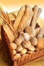 Italian food products, basket with some different wheat bread. Royalty Free Stock Photo