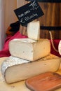 Italian food products, seasoned Goat cheese priced with pure goat written tag