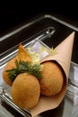 Italian Food Recipe Olive all`ascolana in cornet in to a glass dish. Typical Italian street-food appetizer.