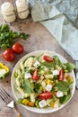 Italian food - Salad with gluten free pasta, spinach, tomatoes, beans and feta cheese on a stone table. Healthy food, vegetarian Royalty Free Stock Photo