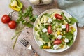 Italian food - Salad with gluten free pasta, spinach, tomatoes, beans and feta cheese on a stone table. Healthy food, vegetarian Royalty Free Stock Photo