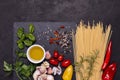Italian food: spaghetti, tomato and aromatic herbs Royalty Free Stock Photo