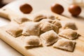 Italian fresh pasta. Panzerotti made by hand on a wooden board. Royalty Free Stock Photo