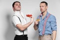 Italian Gangsta and Austrian man posing with funny faces Royalty Free Stock Photo