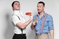 Italian Gangsta and Austrian man posing with funny faces Royalty Free Stock Photo