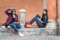 Italian girls are relaxing sitting reading a book