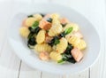 Italian gnocchi pasta with salmon and basil