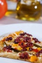 Italian gourmet pizza accompanied by red wine and spices Royalty Free Stock Photo