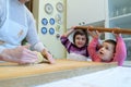 Grandmother teaches her grandchildren how to make pasta