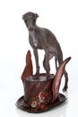 Italian Greyhound puppy stands on a steampunk style hat Royalty Free Stock Photo