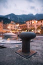 Italian harbour scene on the evening: cute village in the blurry background