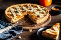 Italian homemade persimmon tart or crostata with one piece on the plate, ingredients over wooden background