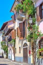 Italian house decorated with flowers in Piedmont, Italy. Royalty Free Stock Photo