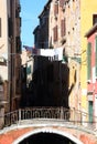 Italian houses with the bridge and clothes hanging out to dry in the sun Royalty Free Stock Photo