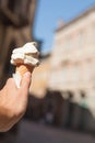 Italian ice cream cone in hand on the background Padua streets , Italy Royalty Free Stock Photo