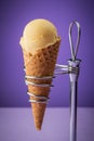 Delecious italian icecream in cone, close up on purple background Royalty Free Stock Photo