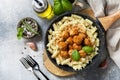 Italian  kitchen. Italian fusilli pasta with meat balls in tomato sauce and basil on grey stone background. Flat lay, top view Royalty Free Stock Photo