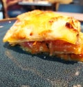 Italian lasagna with pumpkin on a plate, close-up.